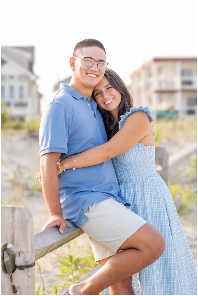 Engaged couple enjoying the nostalgic charm of the Ocean City NJ boardwalk